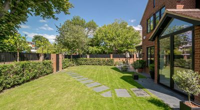 Edwardian red-brick corner plot with wrap around garden